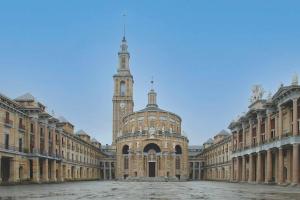 a large building with a clock tower in the distance at Begoña Centro by FlowHome in Gijón