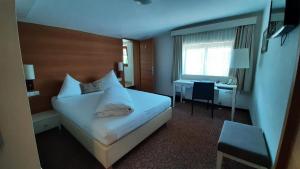 Łóżko lub łóżka w pokoju w obiekcie Alpenrose Kufstein