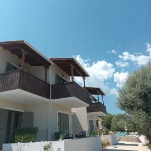 a house with balconies on top of it at KOTSERIS LUXURY VILLAS, Jiovanni Villa & Angelina Villa in Sivota