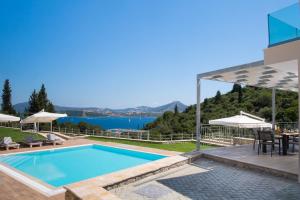 a villa with a swimming pool and a view at Aspasia's mansion in Lygia