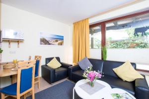 Posezení v ubytování Ferienhof Kluvetasch Appartement Nr 1 - Ostseekrabbe + 12 fotografií