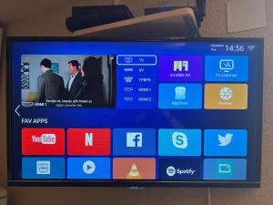 a television screen with a bunch of apps on it at Green Hills II by Rent a car MI in Podgorica
