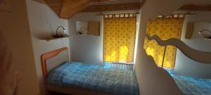 Postel nebo postele na pokoji v ubytování Casa al Lago tra le Dolomiti