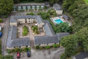 an aerial view of a house with a swimming pool at Lamorna in Mawnan Smith
