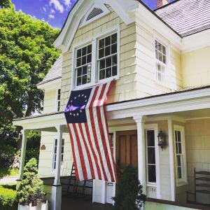 an american flag on the front of a house at The 1708 House in Southampton