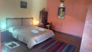 Una cama o camas en una habitación de hosteria camino del inca