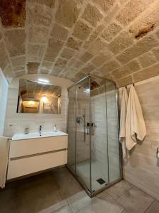 a bathroom with a shower and a sink at Donna Maria Pina in Monopoli