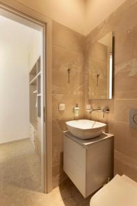 a bathroom with a sink and a mirror at Villa Aura Loutraki in Loutraki +38 photos