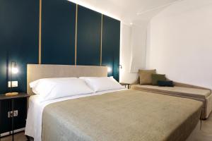 Łóżko lub łóżka w pokoju w obiekcie Mazzini Accommodation