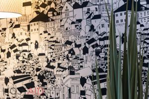 a wall with a drawing of a city at A5 Apartment - Budapest - hostAID in Budapest