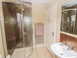 a bathroom with a shower and a sink at Calm Skies in Berwick-Upon-Tweed +43 photos