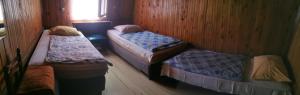 Un ou plusieurs lits dans un hébergement de l'établissement Great Mountain B&B Platak