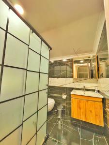 a bathroom with a sink and a toilet in it at Raha Villa Bungalow in Uzungol +40 photos
