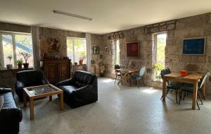 a living room with couches and a table at Azoyan Holiday Resort in Sisian