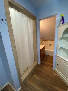 a bathroom with a shower and a closet at Diamond Apartment -Downtown Location in Lawton