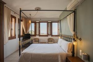 Postel nebo postele na pokoji v ubytování Archontiko Anemos