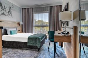 Łóżko lub łóżka w pokoju w obiekcie Sopotorium Hotel & Medical Spa