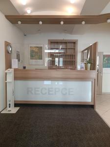 a lobby with a reception desk in a building at Rezidence Dlouha 17 in Prague