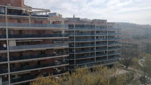 an apartment building with balconies on the side of it at Il Nido del Belocchio in Perugia