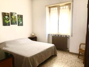 Postel nebo postele na pokoji v ubytování HOME TONINO