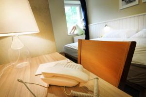 Postel nebo postele na pokoji v ubytování Wellness Hotel Bozeňov