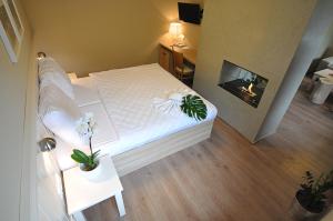 Postel nebo postele na pokoji v ubytování Wellness Hotel Bozeňov