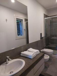 a bathroom with a sink and a toilet at Adagio Ravello in Ravello