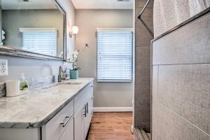 a bathroom with two sinks and a shower at Old Town Walkable Paradise with Private Patio! in Alexandria +22 photos