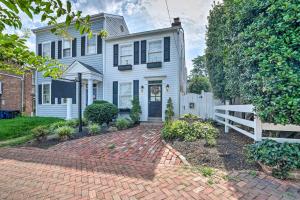 a white house with a white fence and a brick driveway at Old Town Walkable Paradise with Private Patio! in Alexandria