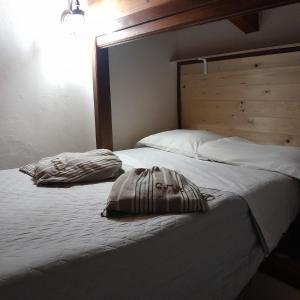 Posteľ alebo postele v izbe v ubytovaní Case Mastro Renzo tour naturalistico enogastronomico