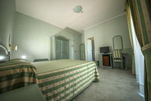 Postel nebo postele na pokoji v ubytování Hotel Murano