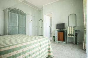 Postel nebo postele na pokoji v ubytování Hotel Murano + 21 fotografií