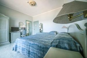Postel nebo postele na pokoji v ubytování Hotel Murano