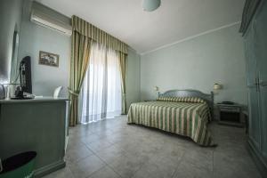 Postel nebo postele na pokoji v ubytování Hotel Murano