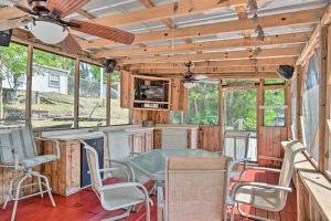 a living room with a table and chairs in a house at Peaceful Satsuma Escape with Dunns Creek Access in Satsuma