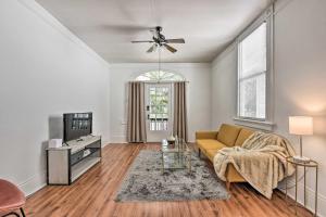 a living room with a couch and a tv at Historical NOLA Home about 3 Mi to French Quarter in New Orleans