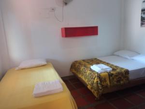 Cama o camas de una habitación en Hostal Santa Cecilia