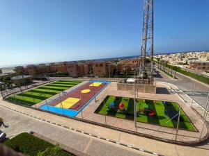 an aerial view of a park with trampoline courts at Villa Yasmin404 in Marsa Matruh