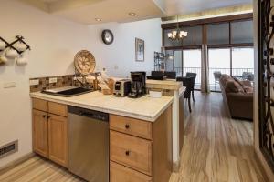 a kitchen with a sink and a counter top at Tamarron Gambel Oak - 794 in Durango