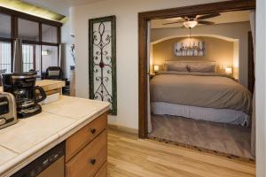 a bedroom with a bed and a large mirror at Tamarron Gambel Oak - 794 in Durango +33 photos