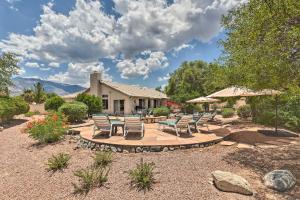 a patio with chairs and tables in a yard at Saddlebrooke Home with Private Pool and Amenities in Catalina