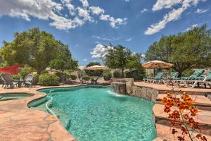 a pool at a resort with tables and chairs at Saddlebrooke Home with Private Pool and Amenities in Catalina