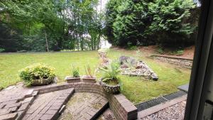 a view of a garden with potted plants in a yard at Modern Loft near City I free Parking I WiFi in Bochum