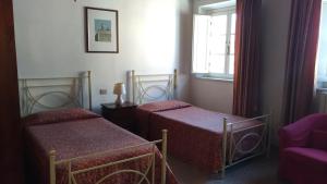 Un pat sau paturi într-o cameră la Residence Domus