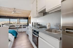a kitchen with a sink and a counter top at Studio naturiste venus panoramic view in Cap d'Agde