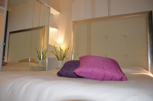 Łóżko lub łóżka w pokoju w obiekcie Appartamenti Europa