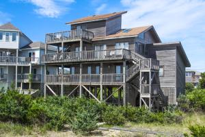 a large house with balconies and condos at Duneshine #73-1 in Avon