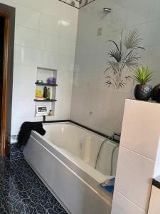 a bathroom with a bath tub in a room at Bice house in Terni