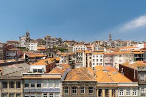 a view of a city with buildings and roofs at Mouzinho Village River in Porto