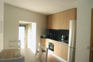 A kitchen or kitchenette at Casa João Eusébio 1